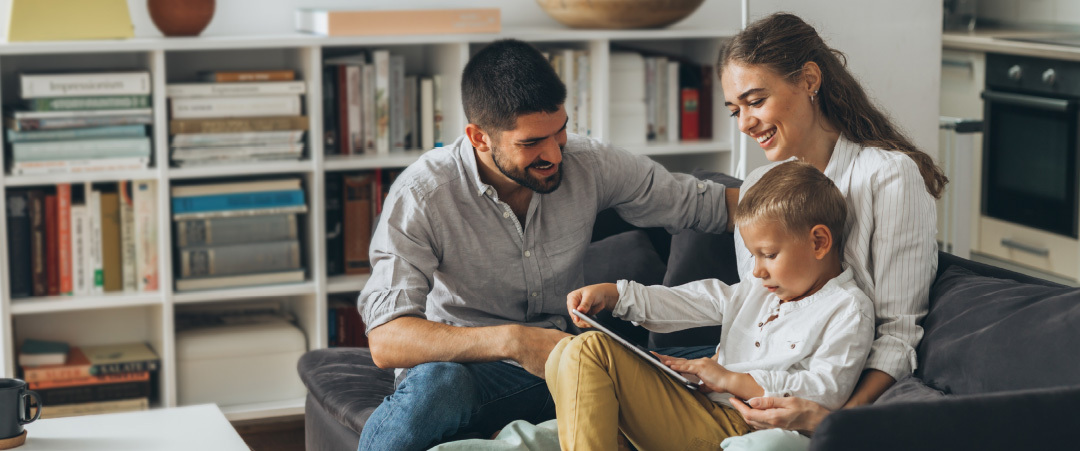 Family viewing an iPad