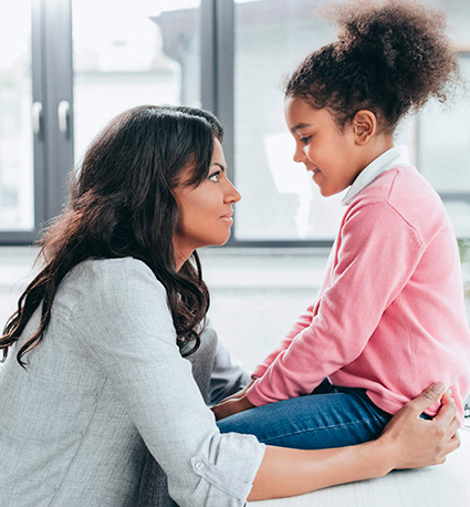 Mother talking to her daughter