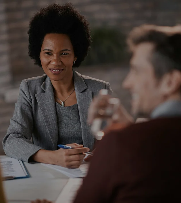 Professional meeting discussion between two colleagues.