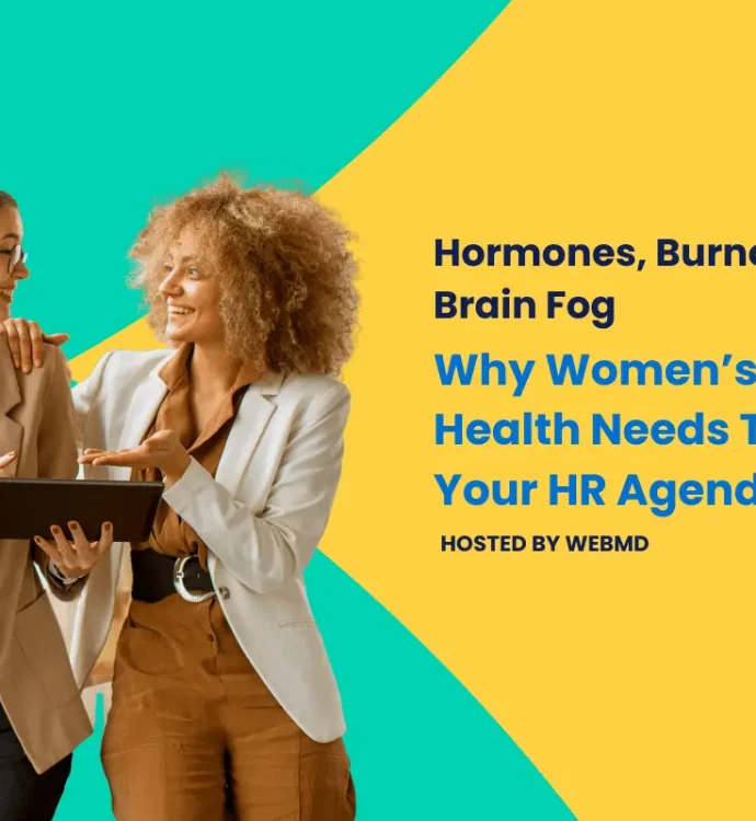 Women in business attire discussing mental health topics on HR agenda.