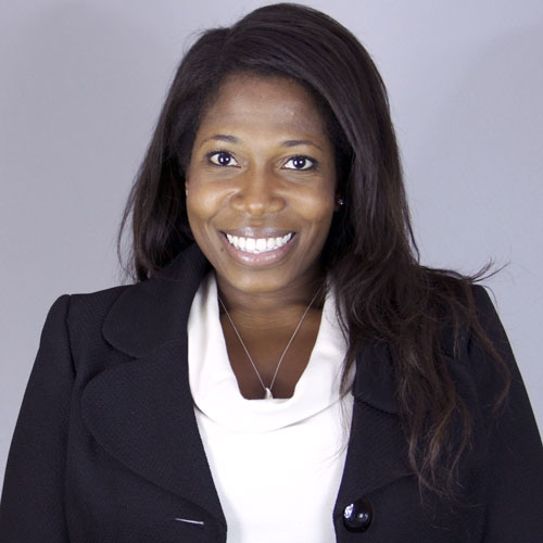 Smiling woman in business attire.