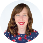 I don’t know who this is, but here’s an alt text suggestion:Smiling woman with red lipstick in floral blouse.