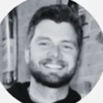 Unknown person in suit and glasses, black and white portrait.